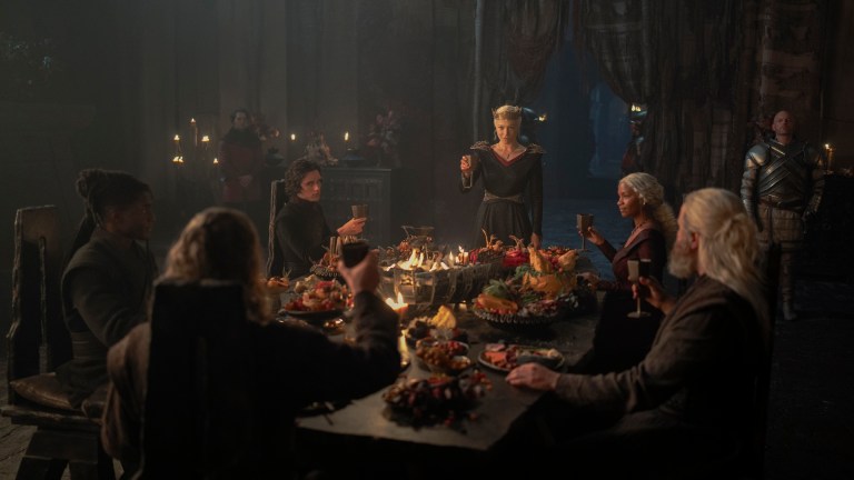 Addam of Hull (Clinton Liberty), Jacaerys (Harry Collett), Rhaenyra Targaryen (Emma D’Arcy), Baela Targaryen (Bethany Antonia), Hugh (Kieran Bew), and Ulf (Tom Bennett) share a meal in Dragonstone
