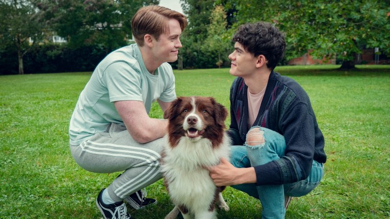 Kit Connor and Joe Locke with a nice dog in Heartstopper season 3.