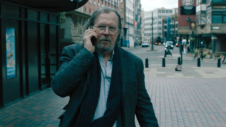 Gary Oldman as Jackson Lamb in Slow Horses season 4 episode 3 on a London street talking on a mobile phone